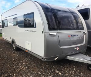 Side-front view of a caravan being stored in a secure location